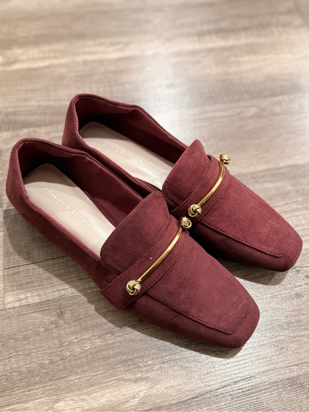 Charles & Keith Burgundy Suede Loafers with Gold Accent